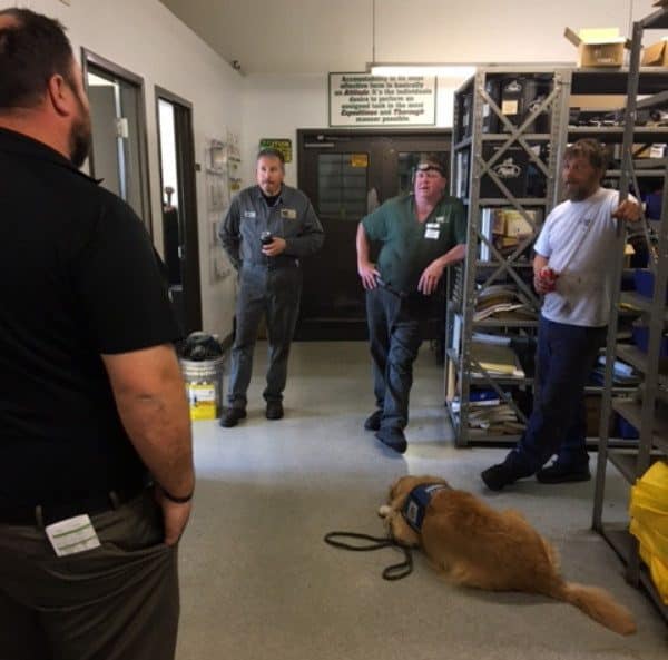 Carl and Jeb having a meeting at the shop. (Photo courtesy Waste Management)