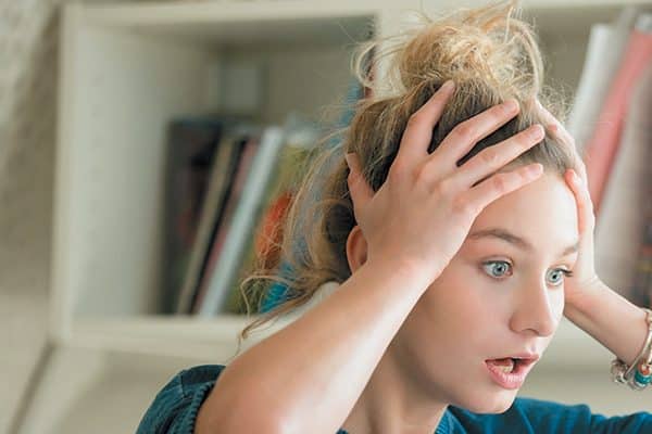 A young girl looking worried.