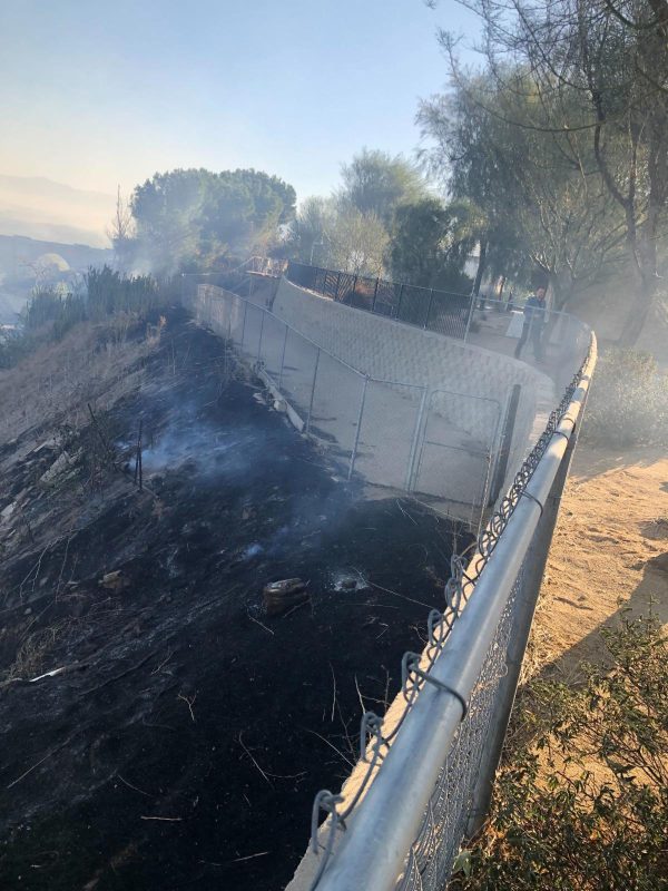 "The charred and burning ground reached all the way up the fences of our play-yard and our Clinic, only a few feet away from our building," says the email the Mary S. Roberts Pet Adoption Center in Riverside, California, sent out to its volunteers. Courtesy PAC.
