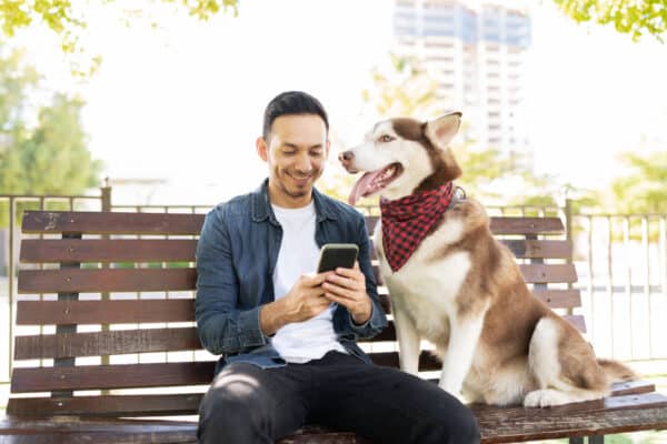 dog owner using smartphone
