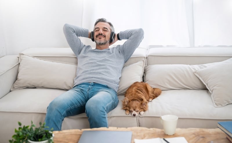 dog owner listening to music