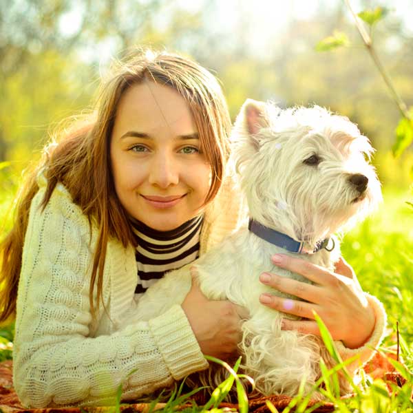 Woman and Westie by Shutterstock.