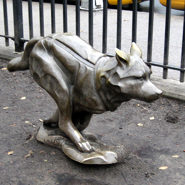 sled dog with statue in central park