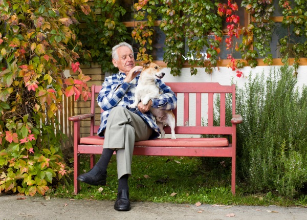 A federally protected arrangement ensures that your dog will be cared for according to your wishes. (Man with dog by Shutterstock)