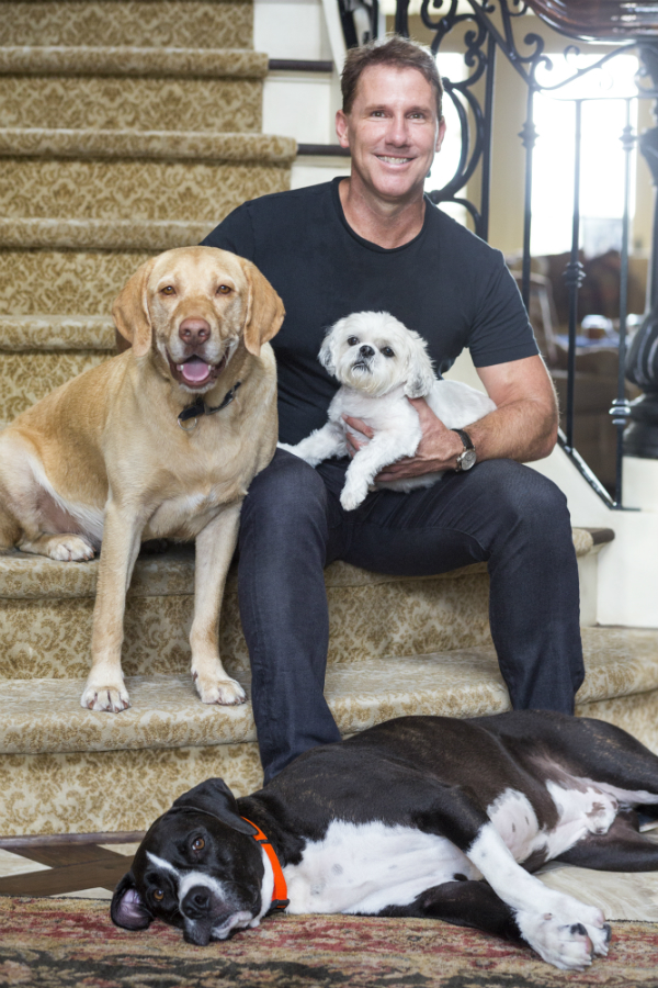 Author Nicholas Sparks with his three rescue dogs. (Photo by Sarah McGraw for PetSmart Charities)
