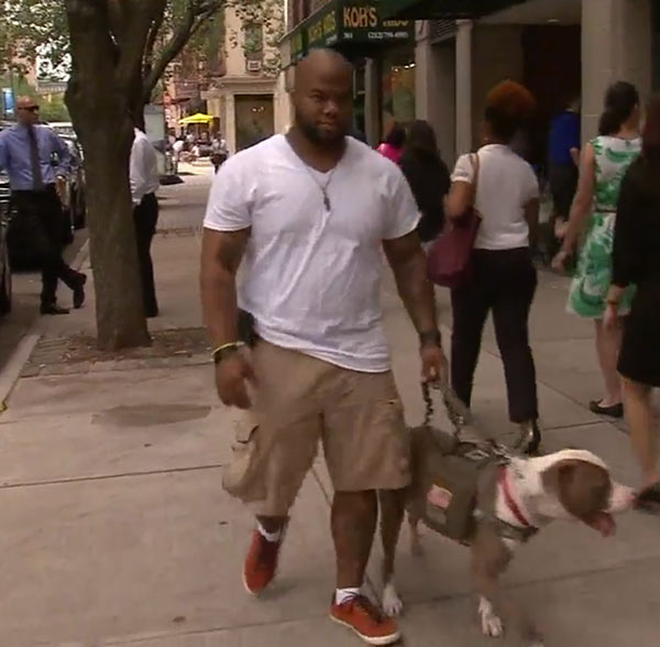 Daniel Wright and Tank on the street.
