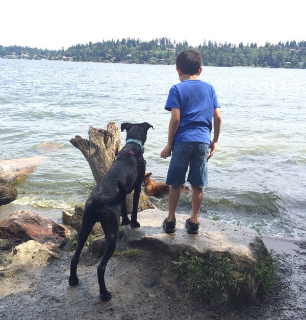 My son Justin with our dog Magnum at the dog park. Photo by Kezia Wilingham.