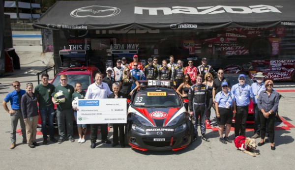 A giant check for a giant donation. (Image courtesy Mazda Motorsports)