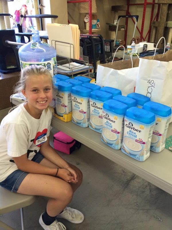 MacKenzie Stanchfield's family adopted from DPS in 2014 and since then she has been an avid volunteer, gathering food and supplies for DPS's youngest puppies! (Photo courtesy DPS)