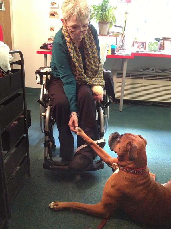 Delmar Gardens resident Jean Warner always has a special treat for her favorite therapy dog. (Photo by Dianne DaLee)