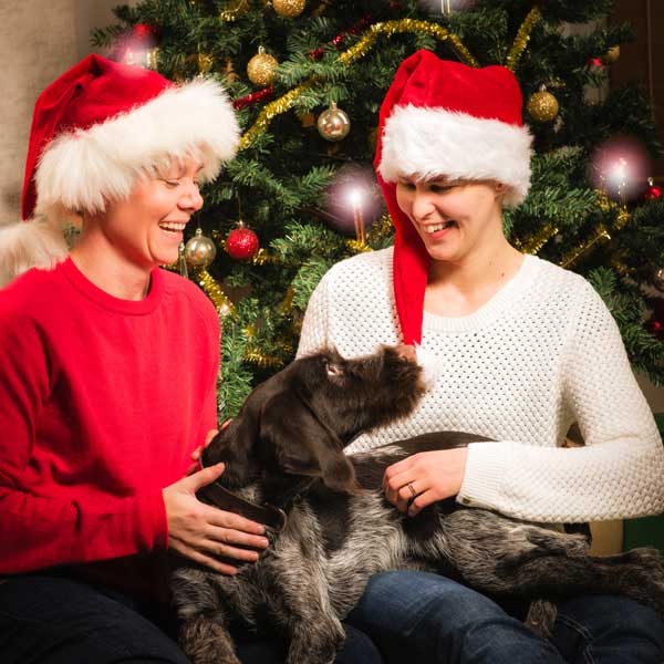 Couple and their dog by Shutterstock