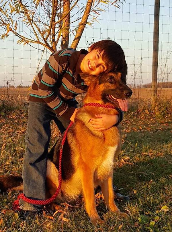 Rumor and 8-year-old Daniel enjoy a hug in the Wisconsin sun. (Photo courtesy Deborah Stern)