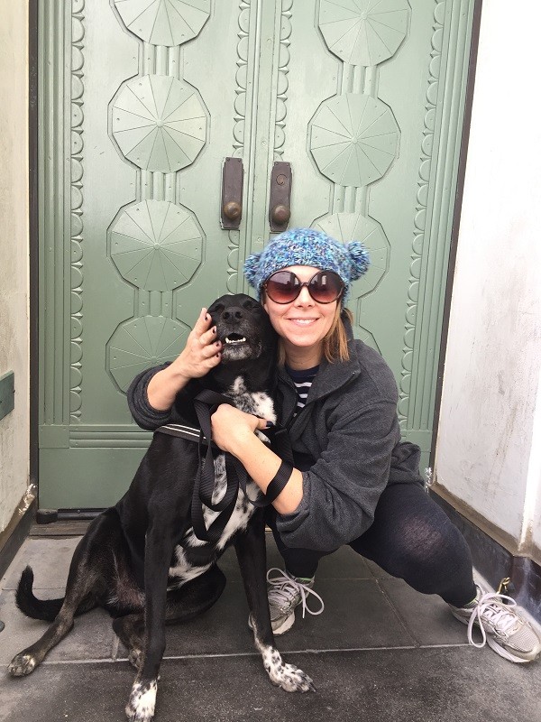 Riggins snuggles close to his human friend Leslie. (Photo by Wendy Newell)