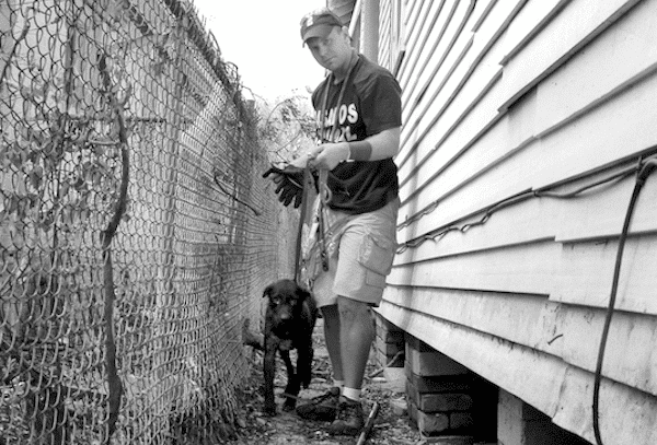 One of Steve’s first Hurricane Katrina rescues was this female dog he found hiding under a house. She was very happy to see him! (Photo courtesy Steve