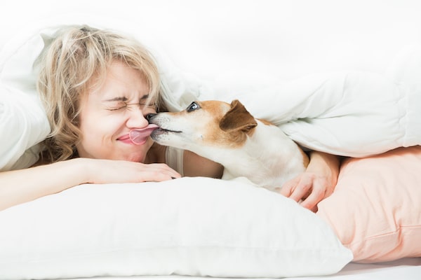 Woman and dog by Shutterstock.