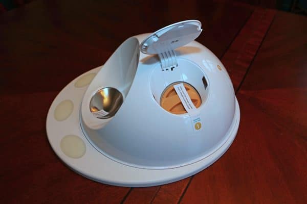 The CleverPet Hub looks a little like a flying saucer, complete with hatch.