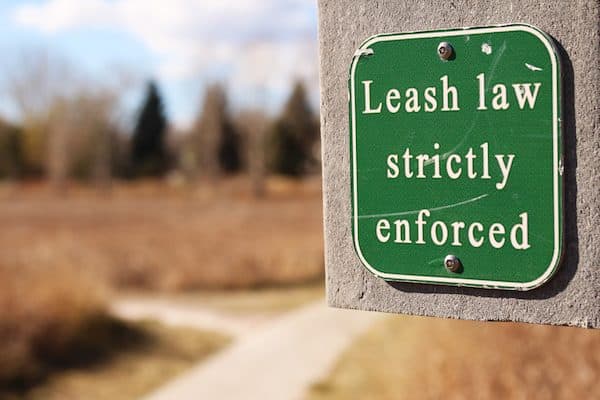 Leash law sign by Shutterstock.