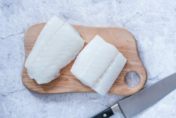 Raw Fish fillets on wooden board
