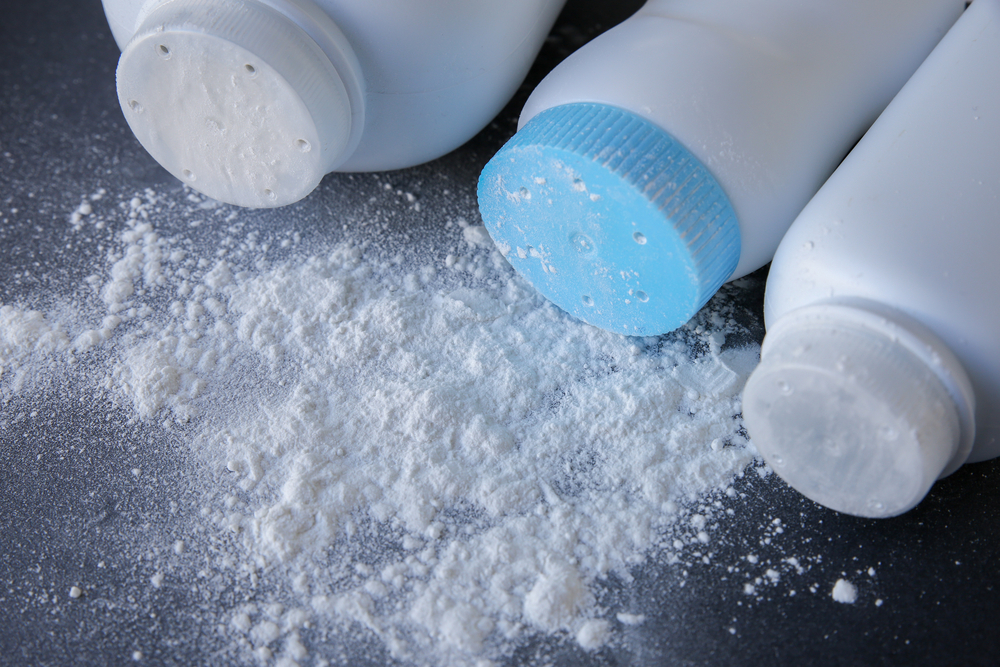 Talcum,Powder,On,Black,Background