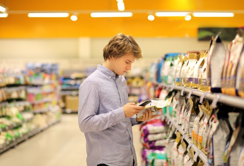 man buying pet food in the store