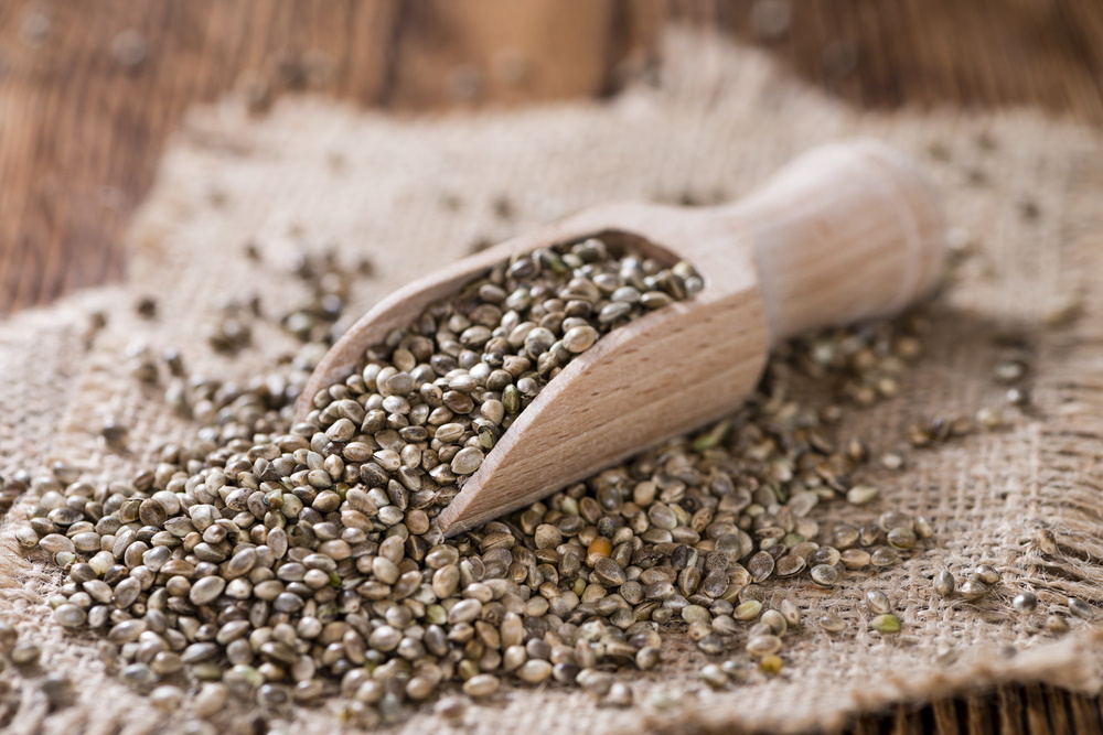 hemp seeds on wooden backround