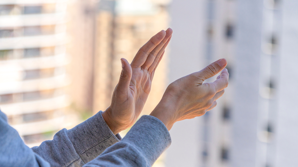 person clapping their hands