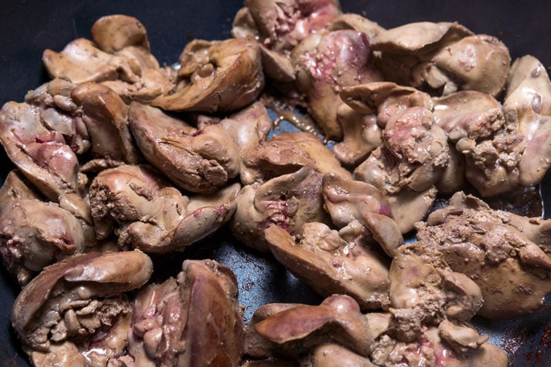 Cooking fried liver in a frying pan close-up