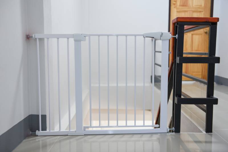 white fence for safety children on stairs or dog gate