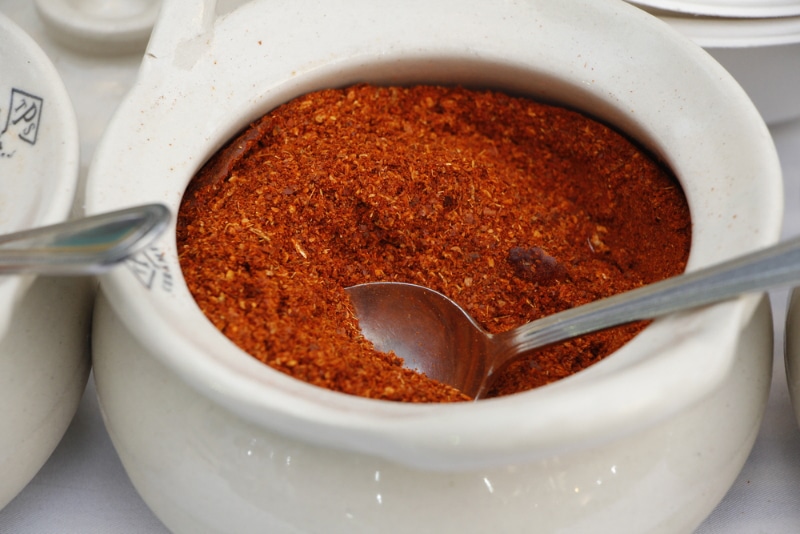 Cayenne pepper in a small container