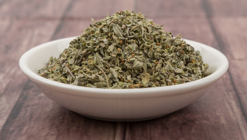a bowl of dried marjoram herbs