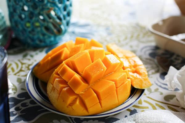 a sliced mango on a plate
