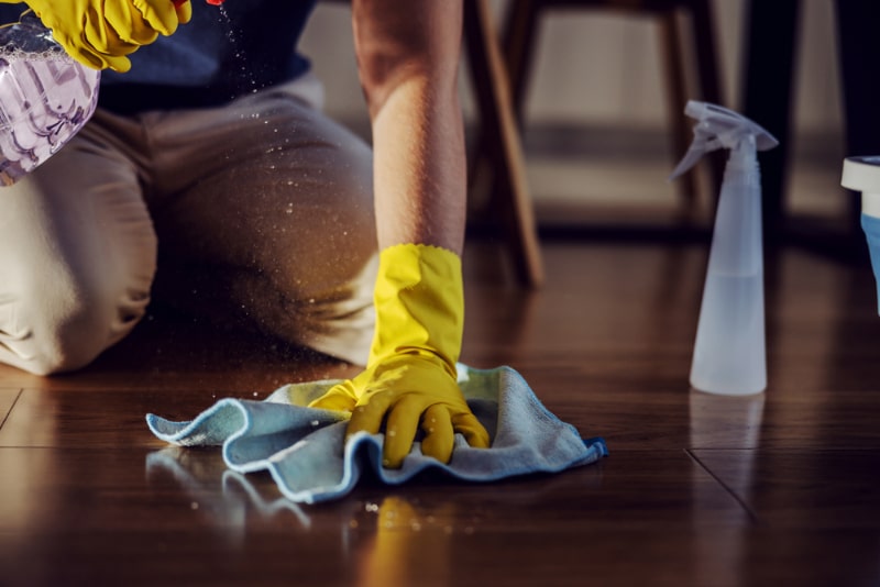 person cleaning the floor