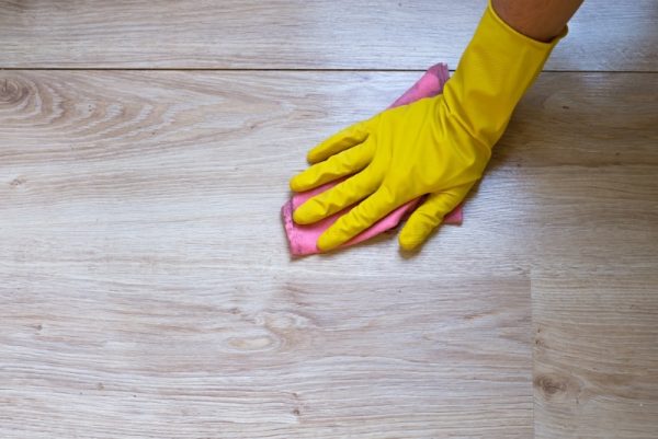 person cleaning the laminate floor