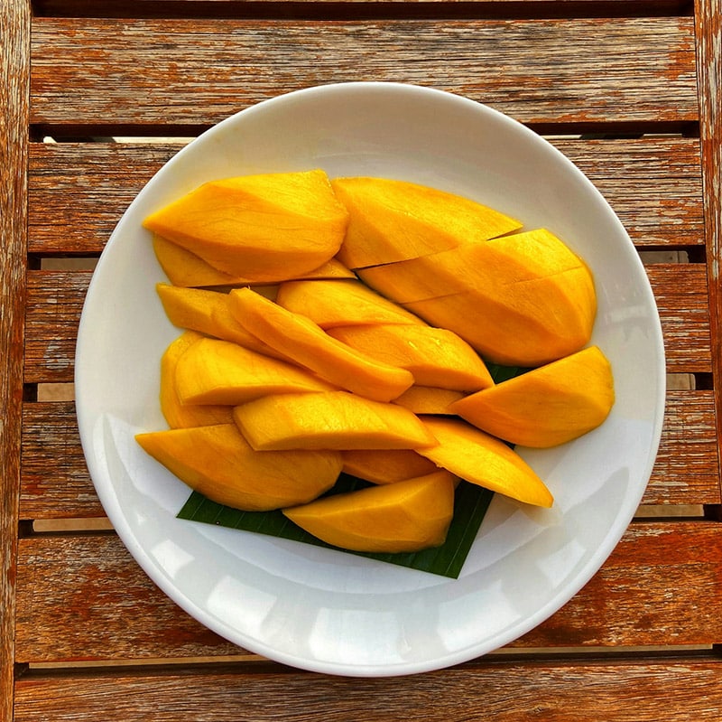 sliced of mango on a plate