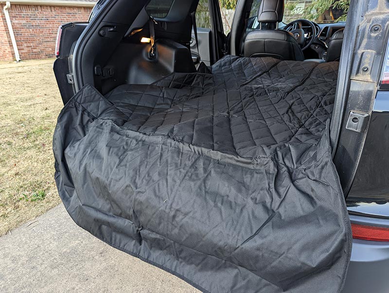 4knines dog split suv cargo liner installed in a car