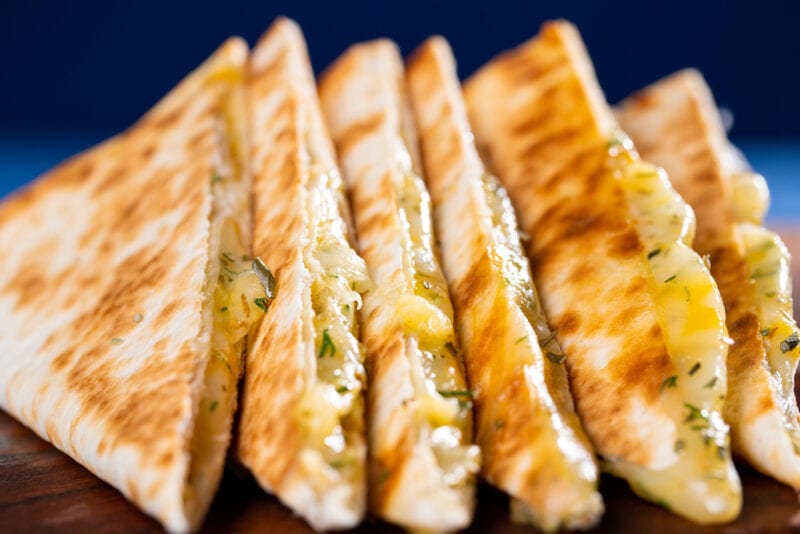 Cheese quesadilla on wooden board