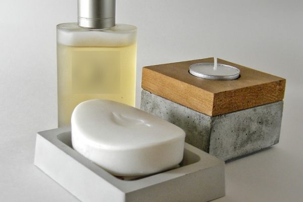 Dove soap on a soap dish with cologne and candle
