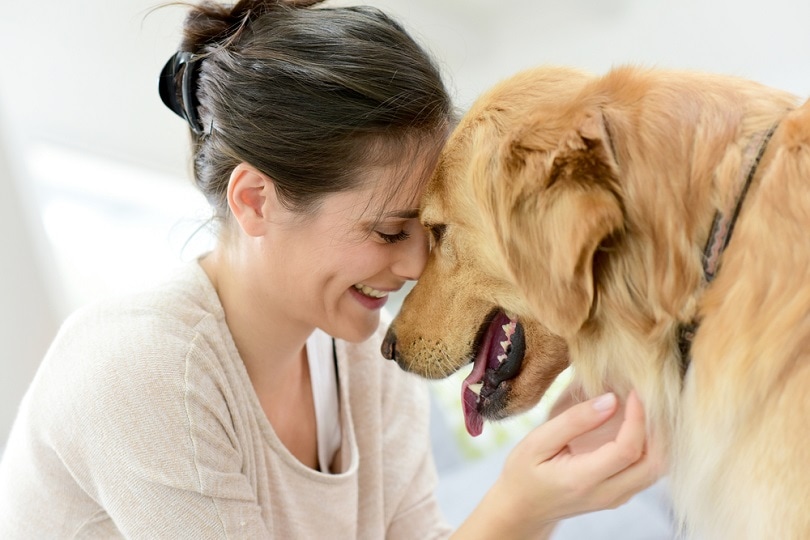 Portrait of woman with dog