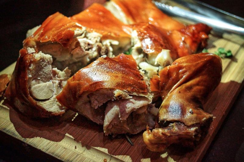 Suckling pig meat on a chopping board