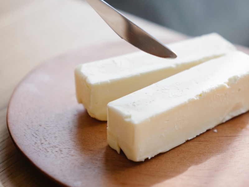 Two sticks of butter and knife