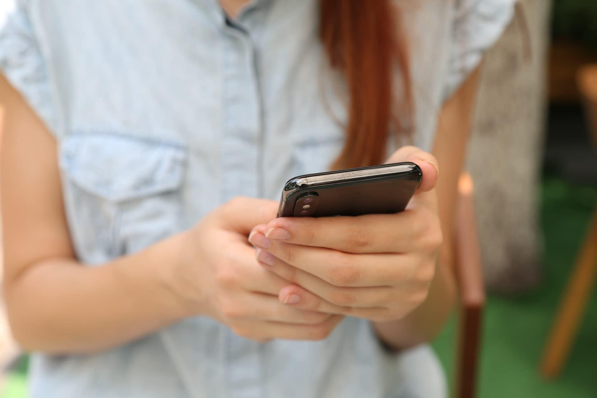 Woman holding mobile phone