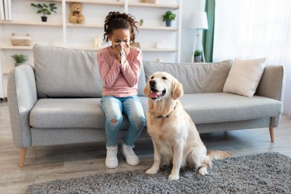 Young girl with allergic reactions to a dog