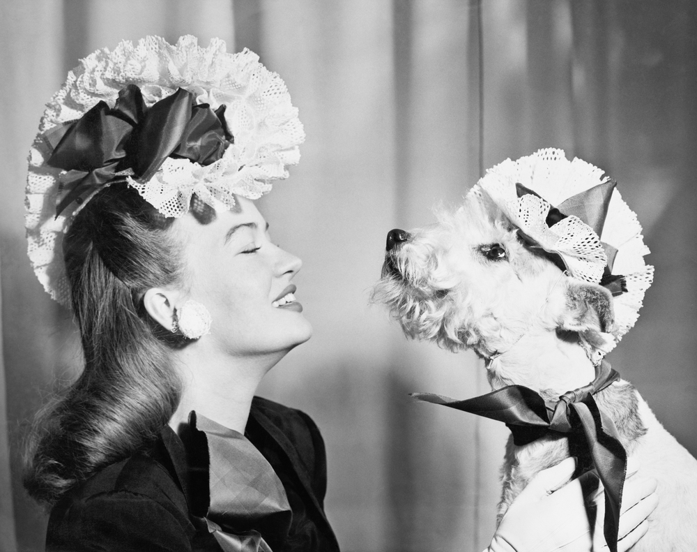 a vintage photo of a woman and her dog