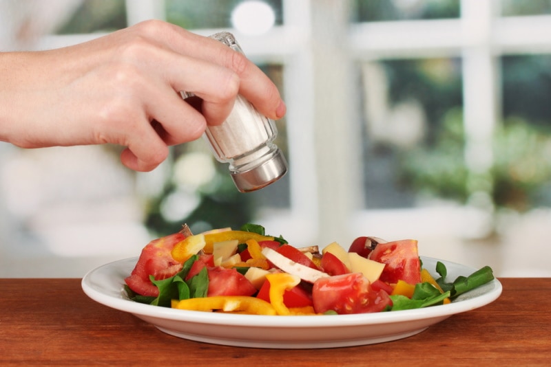 adding salt using salt shaker