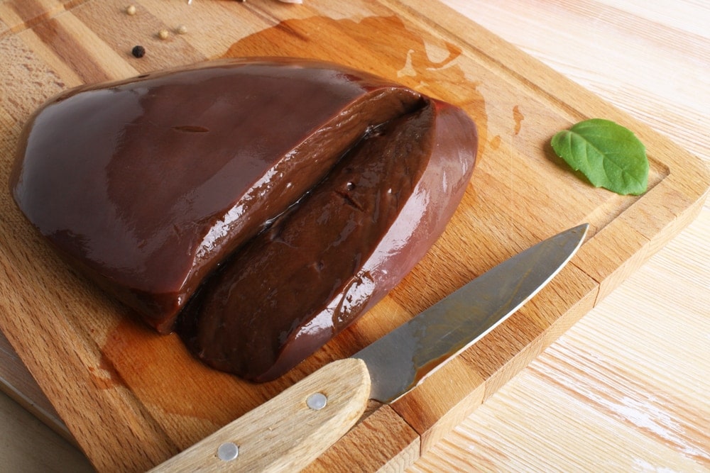 beef liver on wooden board