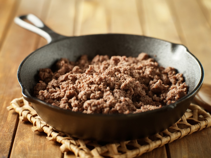 browned ground beef in cast-iron skillet