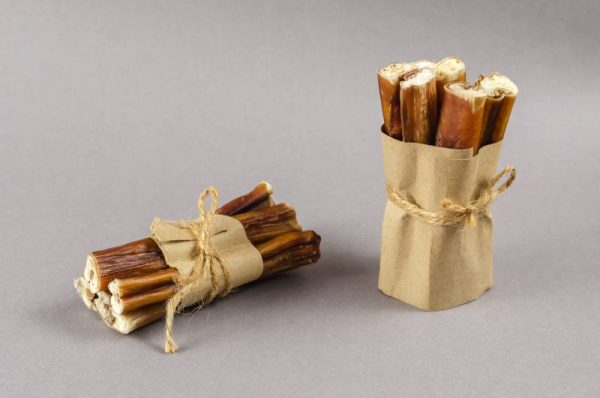 bully sticks for dogs wrapped in brown paper and tied with twine