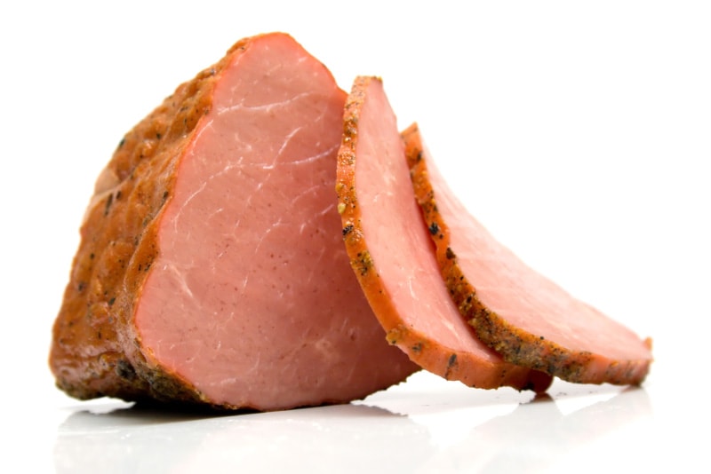 cooked ham in white background