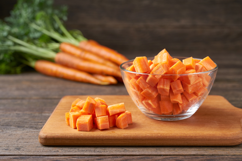 diced carrots on a wooden table