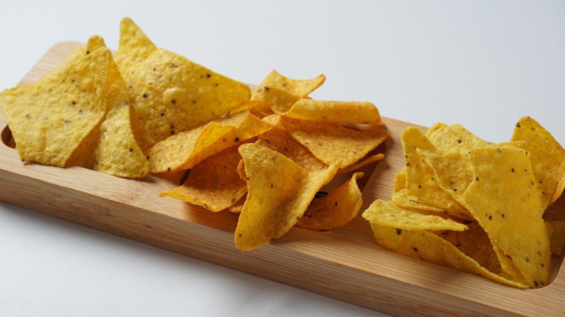 doritos chips on wooden board